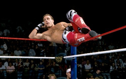 Shawn-Michels-Lying-On-Ropes-In-WWE-Ring-Corner.jpg
