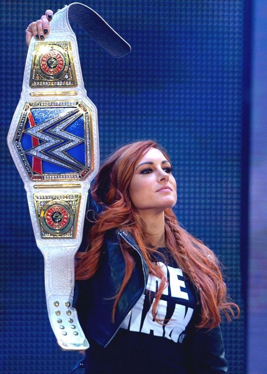 Becky Lynch Showing Her Title Belt